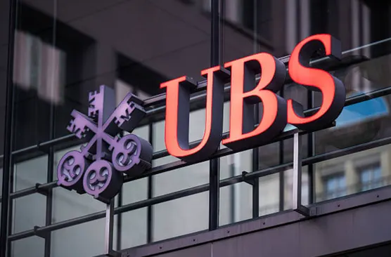 UBS posts $2.7bn quarterly profit and raises integration savings target